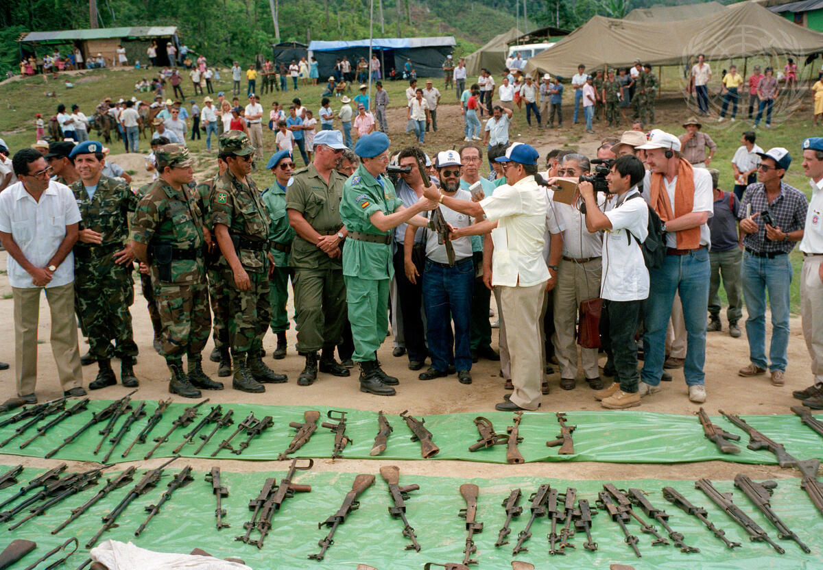 People surrendering hand weapons to army officials. UN Photo/Steen Johansen