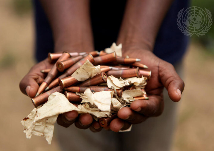 Bare hands holding bullets